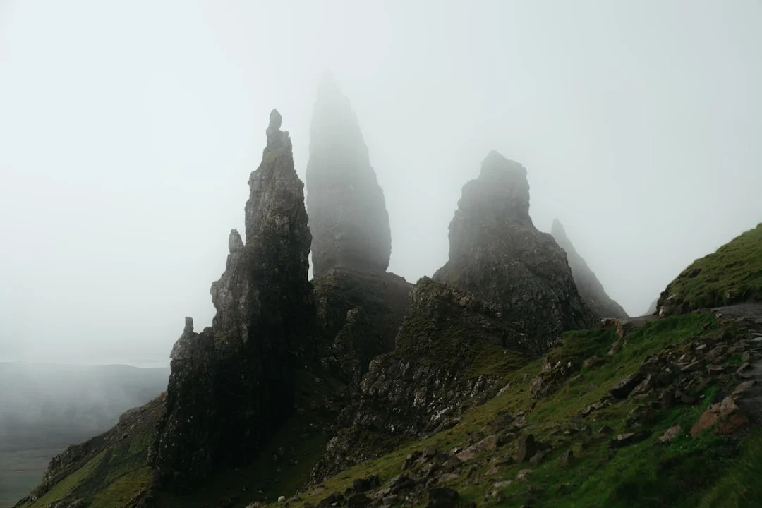 A group of rock formations on a foggy day